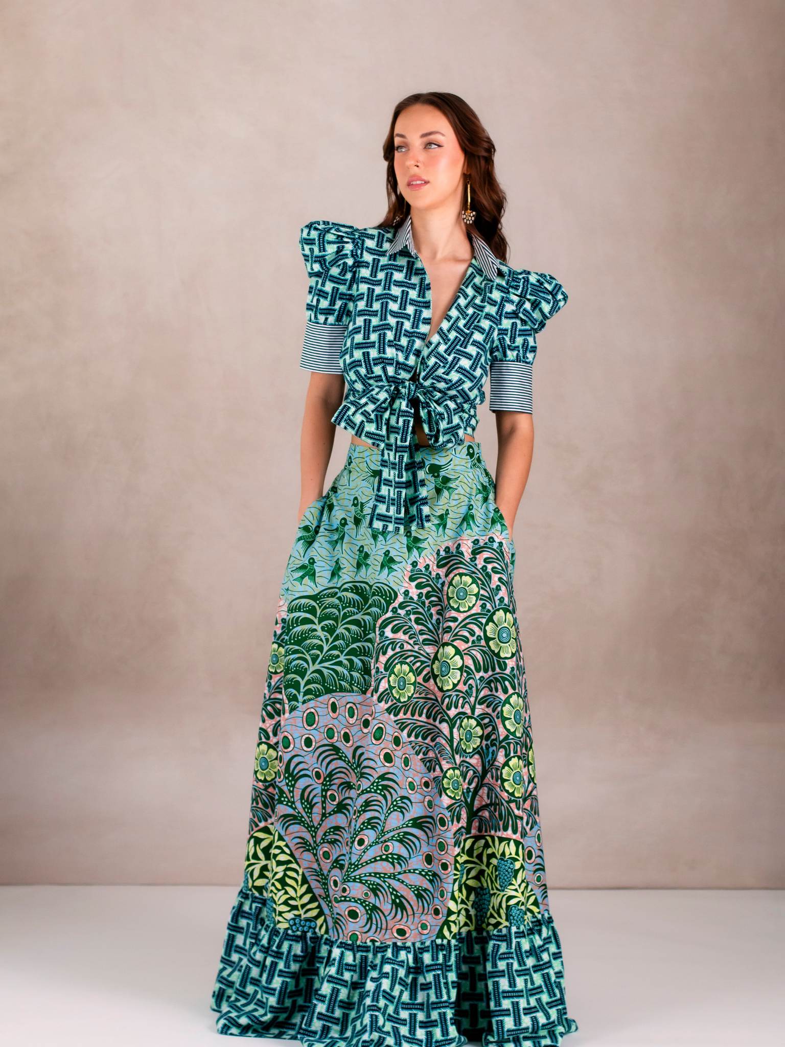Model wears Chen Burkett New York Selah Top and Maxi Skirt in vibrant mixed prints, photographed in studio